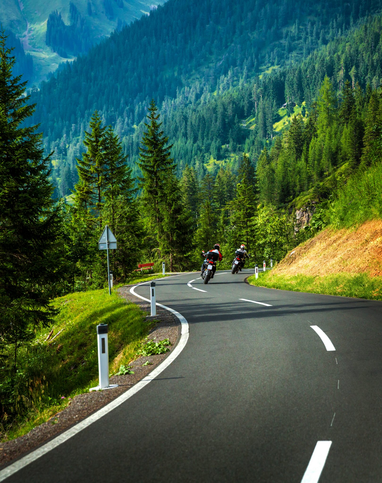 Group of motorcyclists in Alpine mountains